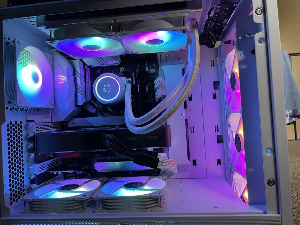 White custom gaming PC with RGB cooling and coordinated components